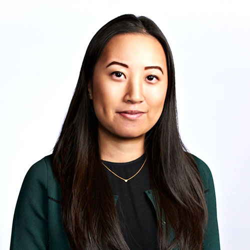 Corporate headshot of female corporate executive on white background