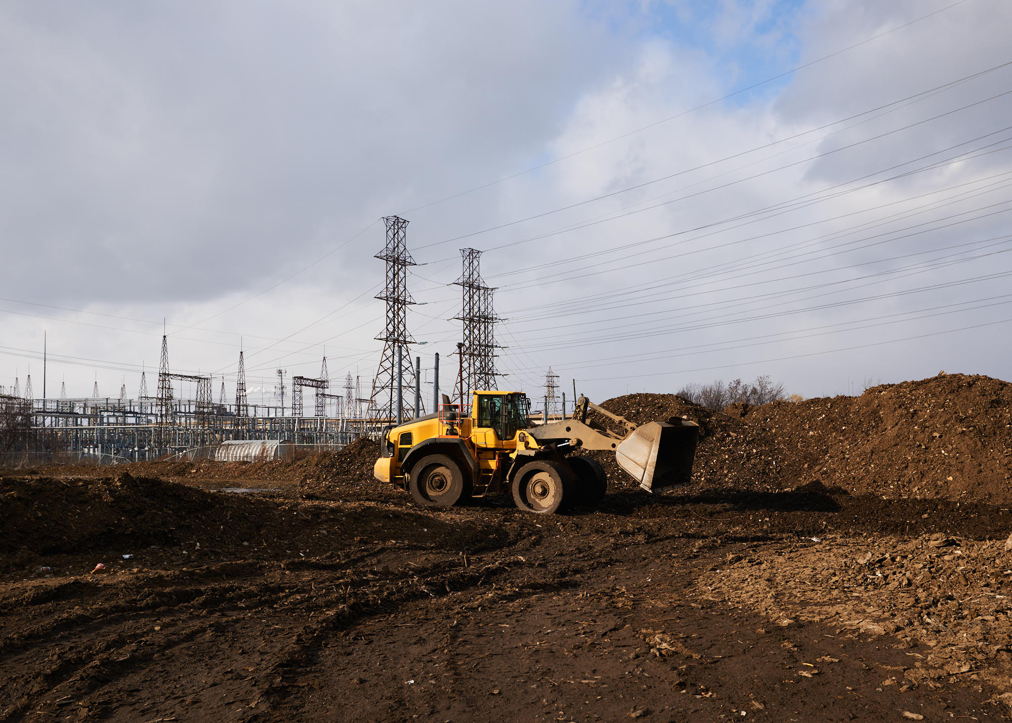 Industrial photography for Toronto steel recycling company depicting earth mover outside