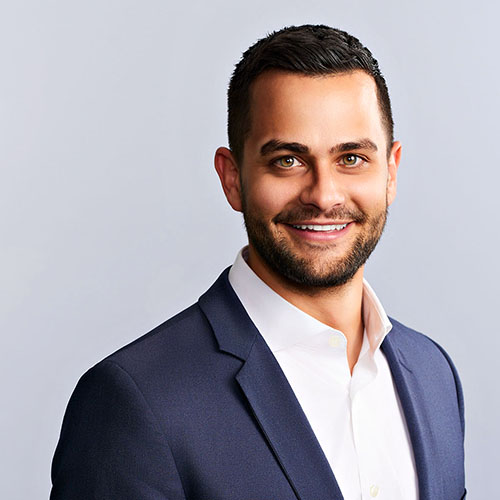 Casual business studio portrait of smiling male banker