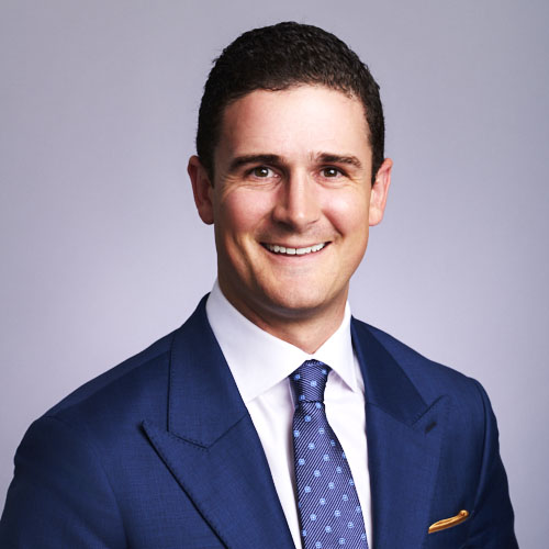 Corporate business headshot of smiling male executive