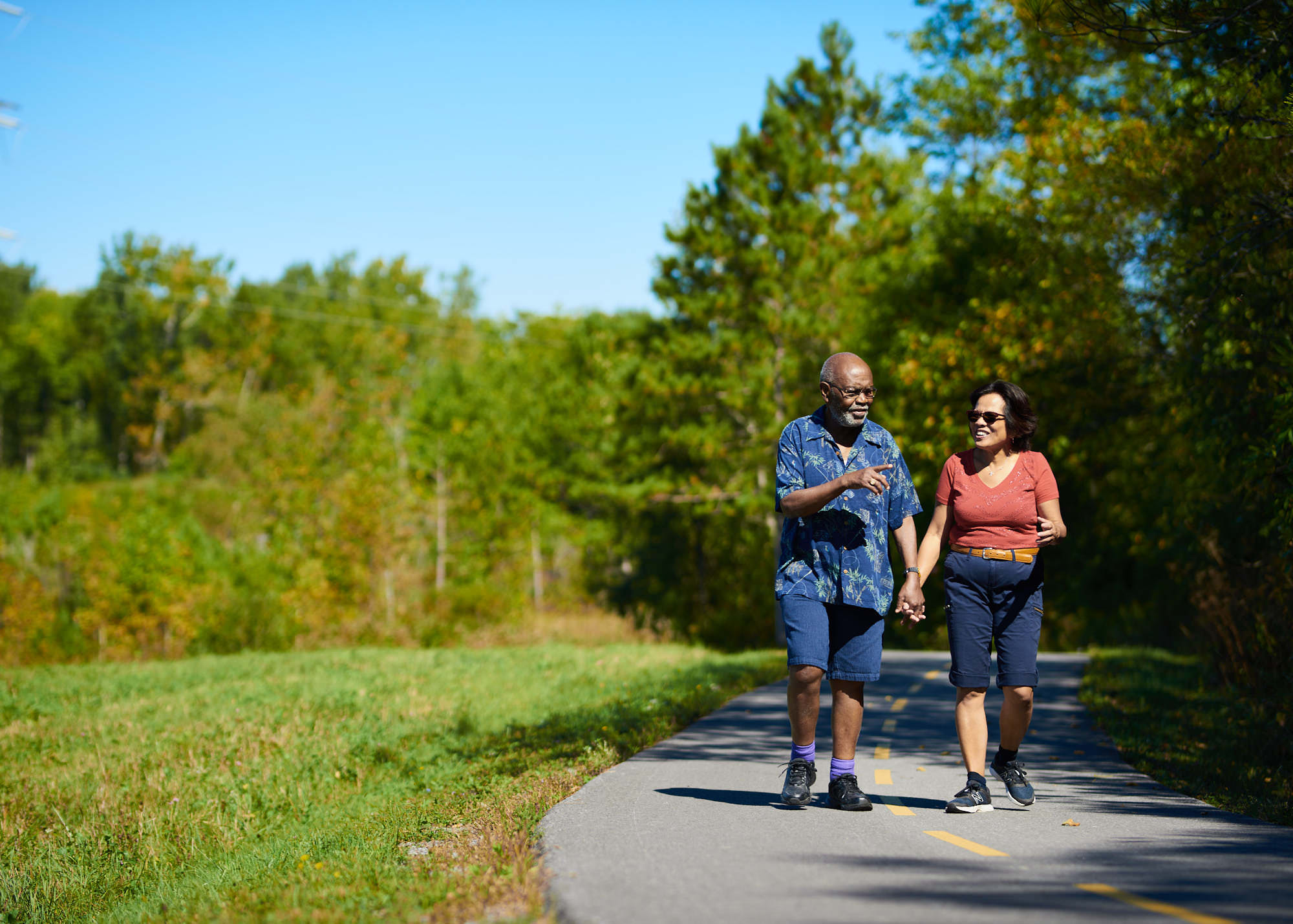 retired-couple-walking-on-exercise-path