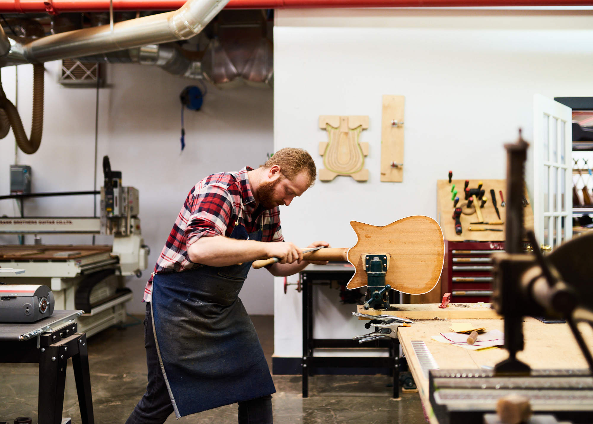 toronto-small-business-guitar-maker-sanding-instrument