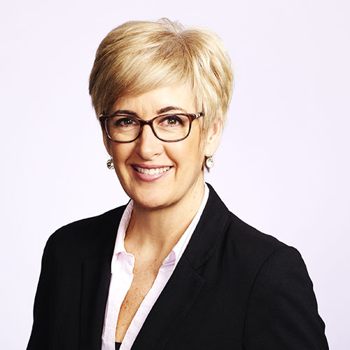 Business headshot portrait of female executive on white background