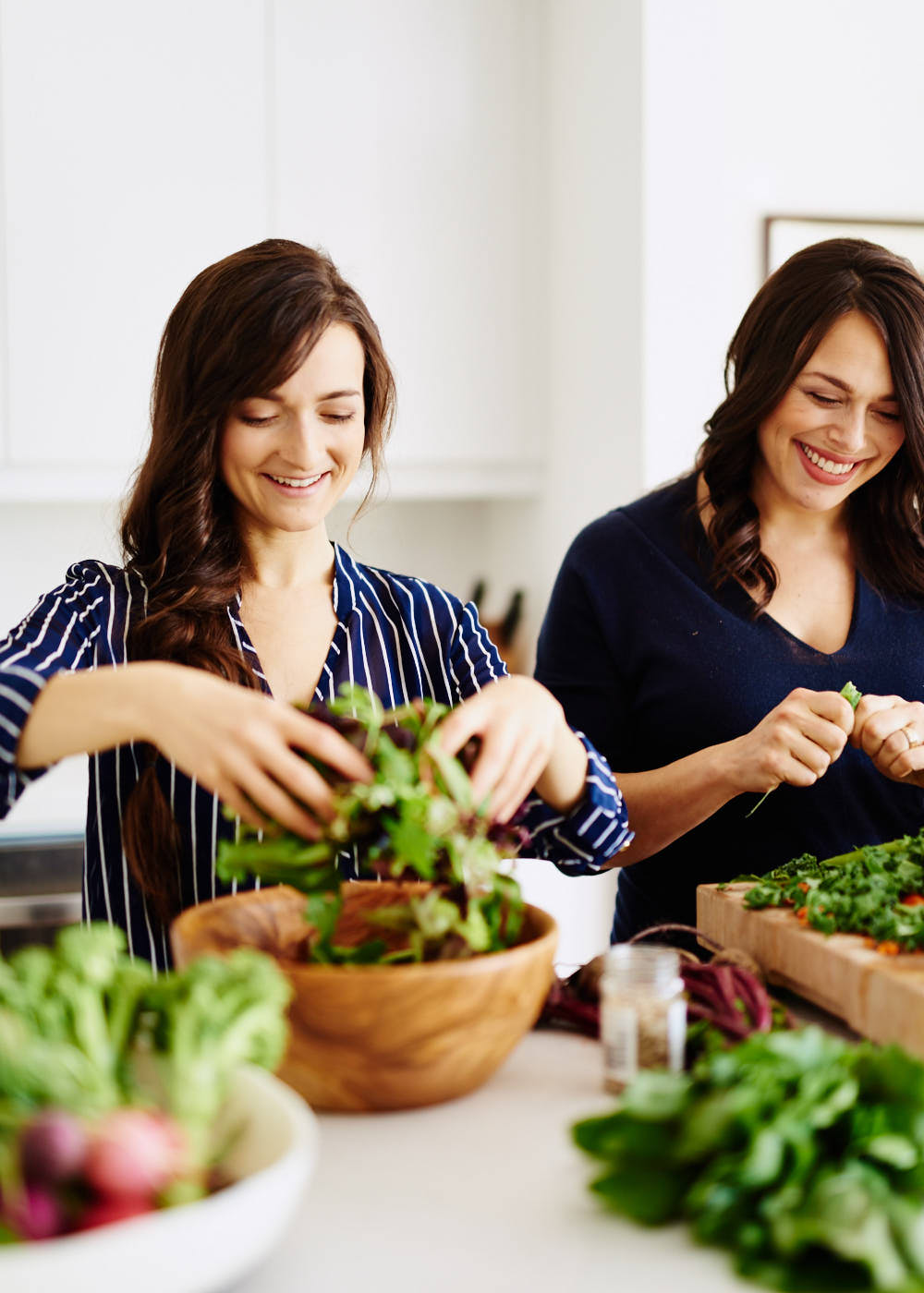 Lifestyle photograph of two female wellness small business owners