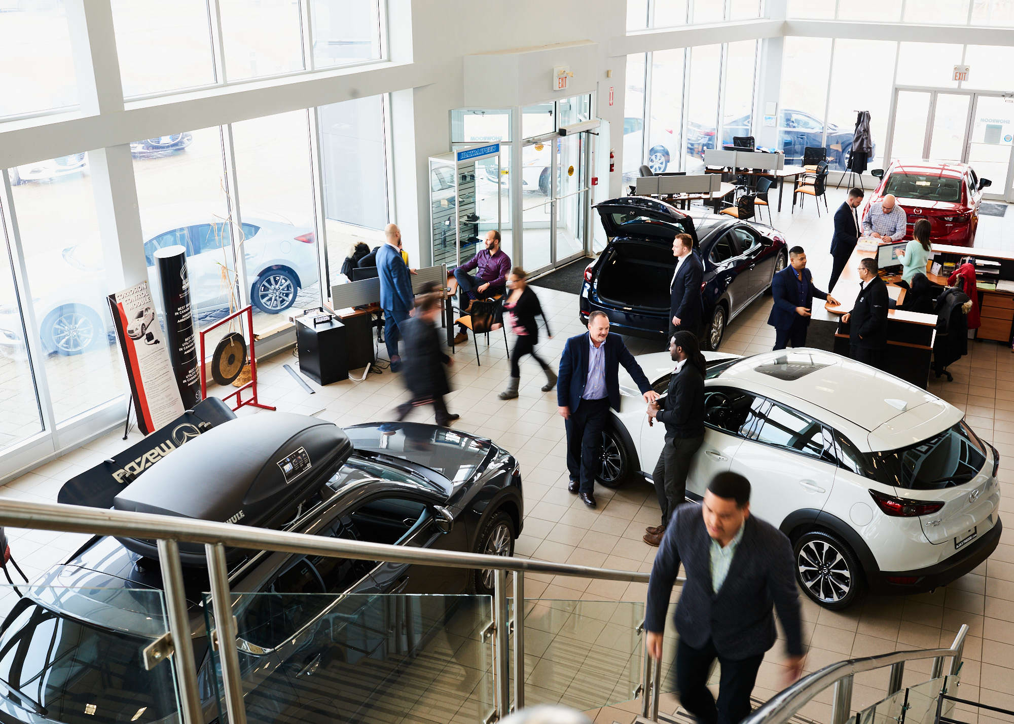 Overhead editorial corporate photograph of Mazda dealership for Apple